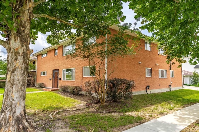 966-968 Allen Toussaint Blvd, New Orleans, LA 70124 - view of home's exterior with a yard and brick siding
