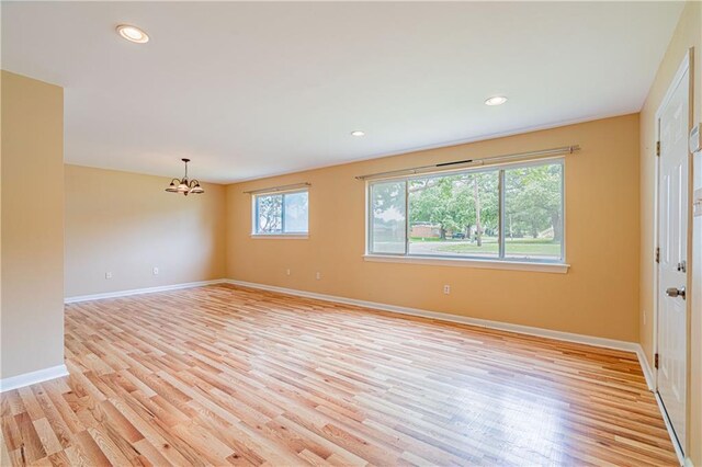 966-968 Allen Toussaint Blvd, New Orleans, LA 70124 - unfurnished room with a chandelier, light wood-style floors, baseboards, and recessed lighting