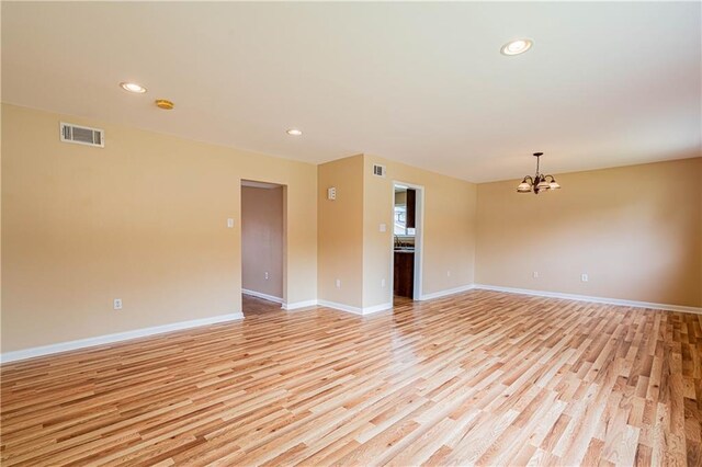 966-968 Allen Toussaint Blvd, New Orleans, LA 70124 - unfurnished room featuring a chandelier, light wood-style flooring, baseboards, and recessed lighting