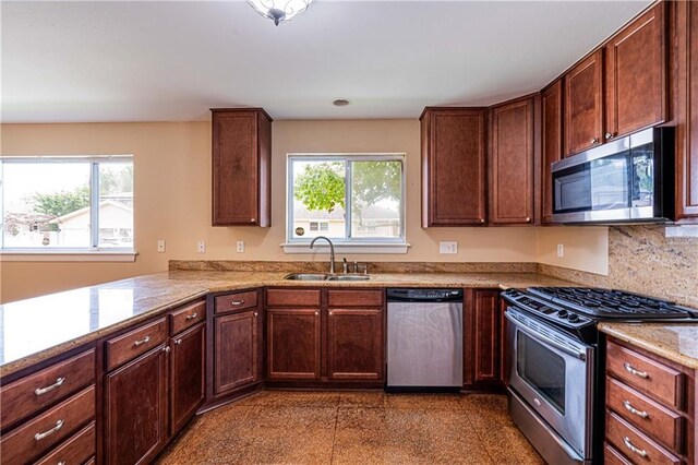 966-968 Allen Toussaint Blvd, New Orleans, LA 70124 - kitchen with stainless steel appliances, a sink, granite tiled floors, and light stone countertops