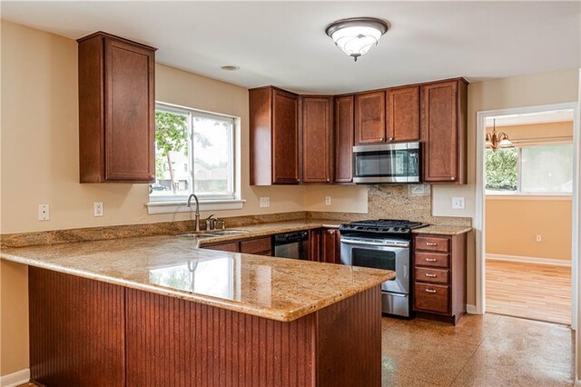 966-968 Allen Toussaint Blvd, New Orleans, LA 70124 - kitchen with stainless steel appliances, a sink, a peninsula, and healthy amount of natural light