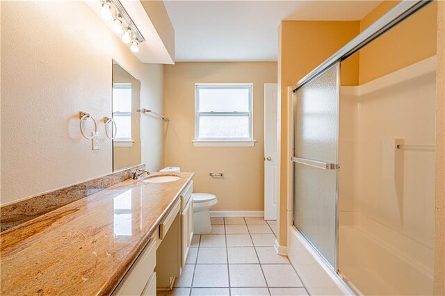 966-968 Allen Toussaint Blvd, New Orleans, LA 70124 - bathroom with toilet, vanity, tile patterned flooring, shower / bath combination with glass door, and baseboards