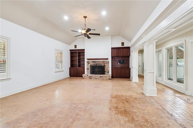 5542 Marcia Ave, New Orleans, LA 70124 - unfurnished living room featuring ornate columns, a ceiling fan, lofted ceiling, brick flooring, and plenty of natural light