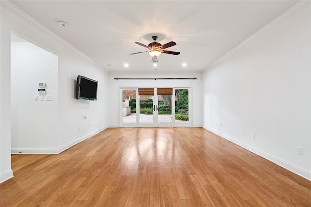 5542 Marcia Ave, New Orleans, LA 70124 - unfurnished living room featuring a ceiling fan, baseboards, light wood-style flooring, crown molding, and french doors