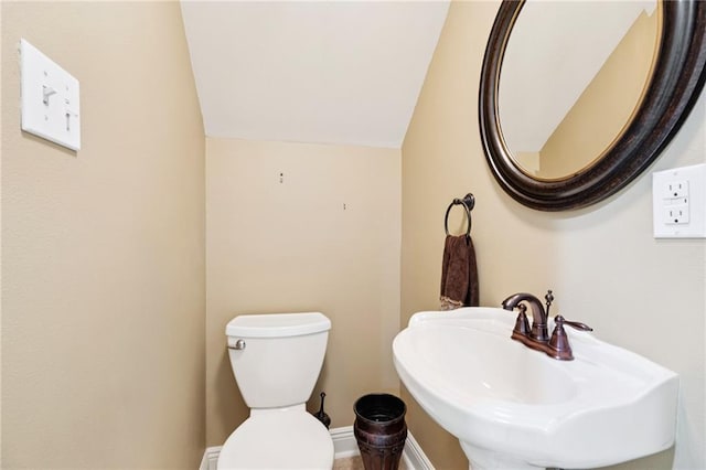 5542 Marcia Ave, New Orleans, LA 70124 - half bathroom with lofted ceiling, a sink, and toilet