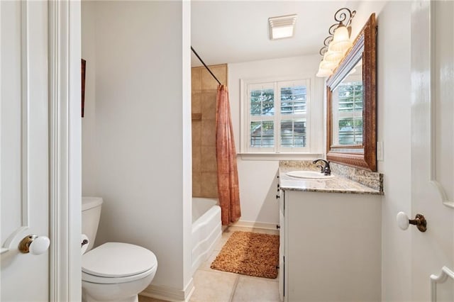 5542 Marcia Ave, New Orleans, LA 70124 - bathroom featuring toilet, vanity, tile patterned floors, shower / bath combo with shower curtain, and baseboards
