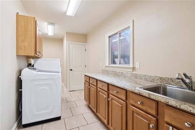 5542 Marcia Ave, New Orleans, LA 70124 - laundry area featuring cabinet space, washing machine and dryer, light tile patterned flooring, and baseboards