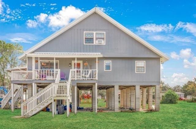 5679 Jean Lafitte Blvd, Jean Lafitte, LA 70067 - back of house with a yard, stairway, and a porch