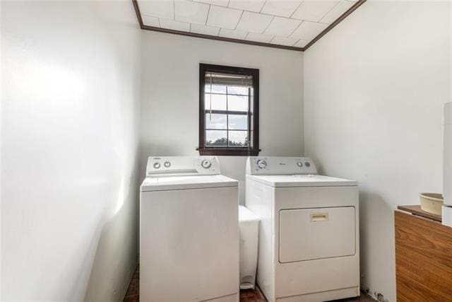 5679 Jean Lafitte Blvd, Jean Lafitte, LA 70067 - laundry area featuring independent washer and dryer and crown molding