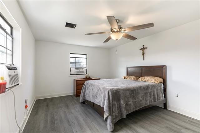 5679 Jean Lafitte Blvd, Jean Lafitte, LA 70067 - bedroom featuring wood finished floors, baseboards, and ceiling fan