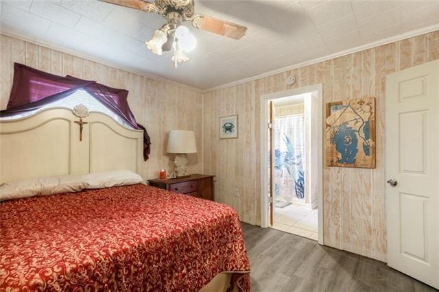 5679 Jean Lafitte Blvd, Jean Lafitte, LA 70067 - bedroom with wood finished floors, ornamental molding, and ceiling fan