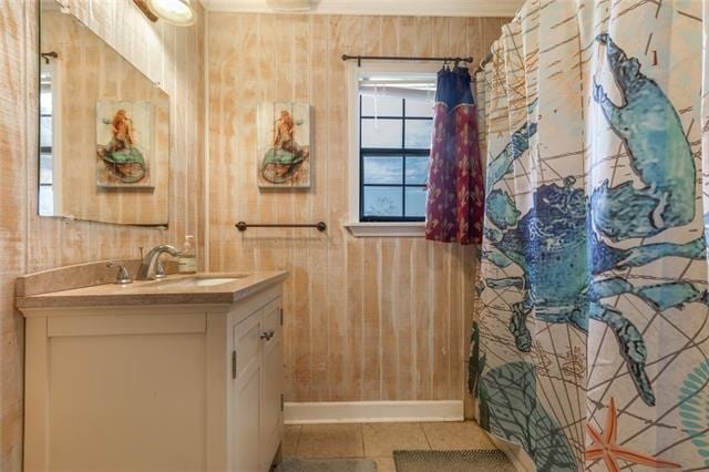 5679 Jean Lafitte Blvd, Jean Lafitte, LA 70067 - bathroom featuring vanity, tile patterned floors, and baseboards