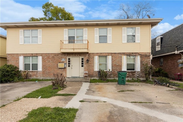 2713 Independence St, Metairie, LA 70006 - view of property featuring brick siding and a balcony