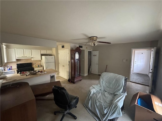2713 Independence St, Metairie, LA 70006 - living room featuring a ceiling fan and light colored carpet