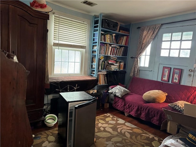 5621 Tchoupitoulas St, New Orleans, LA 70115 - bedroom with wood finished floors and ornamental molding