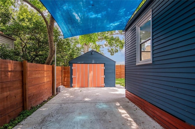 226 Lions St, Jefferson, LA 70121 - fenced backyard featuring a shed and a patio area