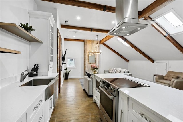 1416 Bourbon St Unit 5, New Orleans, LA 70116 - kitchen with stainless steel electric range oven, island exhaust hood, hardwood / wood-style floors, white cabinetry, and a sink