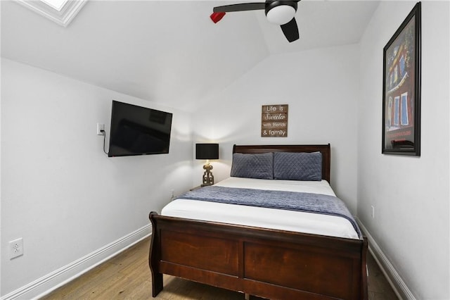 1416 Bourbon St Unit 5, New Orleans, LA 70116 - bedroom with vaulted ceiling, wood finished floors, ceiling fan, and baseboards