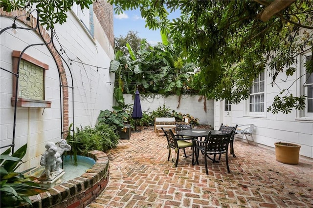 1416 Bourbon St Unit 5, New Orleans, LA 70116 - view of patio featuring outdoor dining space