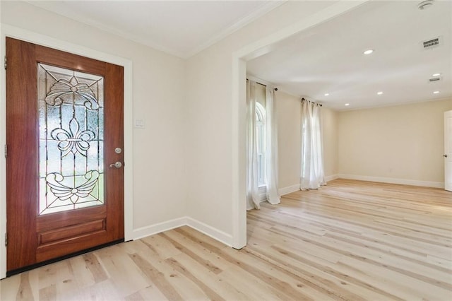4517 Bissonet Dr, Metairie, LA 70003 - foyer with light wood-style floors, crown molding, baseboards, plenty of natural light, and recessed lighting