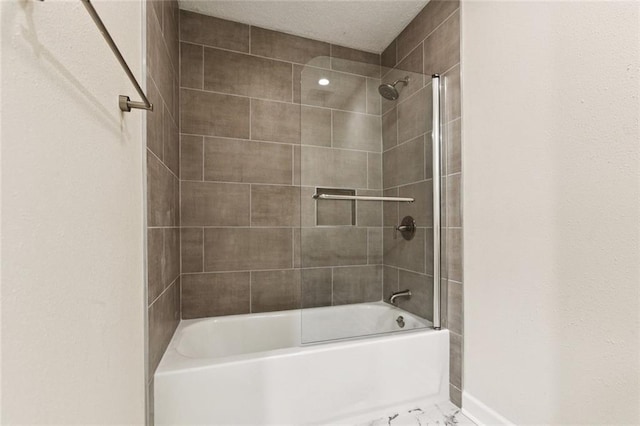 4517 Bissonet Dr, Metairie, LA 70003 - bathroom with shower / bathtub combination, baseboards, and marble look tiles