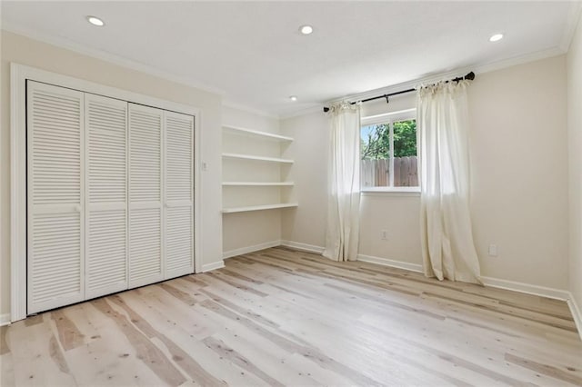 4517 Bissonet Dr, Metairie, LA 70003 - unfurnished bedroom with crown molding, wood finished floors, recessed lighting, baseboards, and a closet