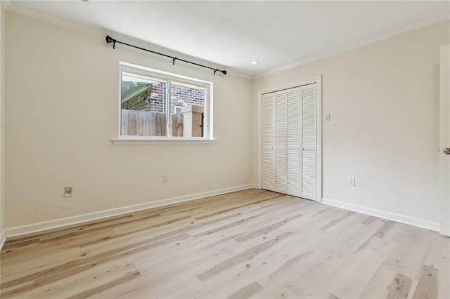 4517 Bissonet Dr, Metairie, LA 70003 - unfurnished bedroom with wood finished floors, a closet, baseboards, crown molding, and recessed lighting