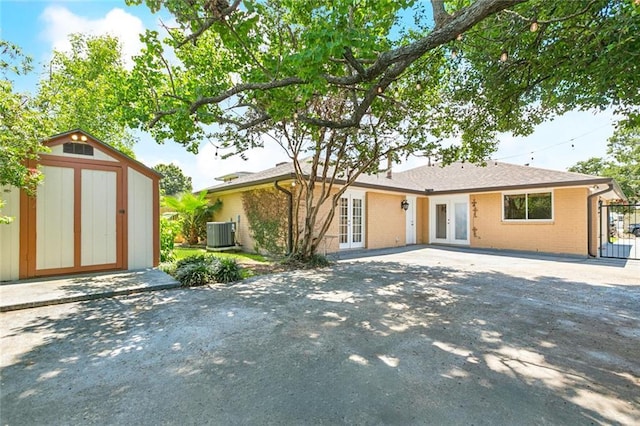 4517 Bissonet Dr, Metairie, LA 70003 - view of front of house with french doors, central AC, and brick siding