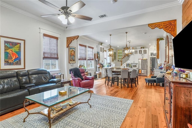 205 S Norman C Francis Pkwy, New Orleans, LA 70119 - living area featuring a ceiling fan, a chandelier, light wood finished floors, and crown molding