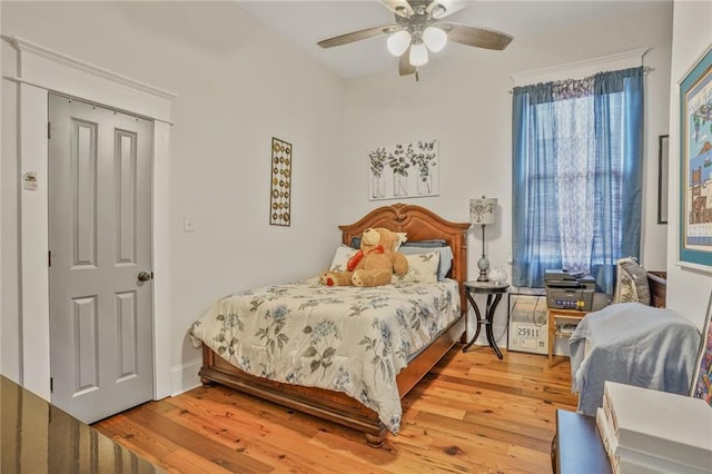 205 S Norman C Francis Pkwy, New Orleans, LA 70119 - bedroom with wood finished floors and a ceiling fan