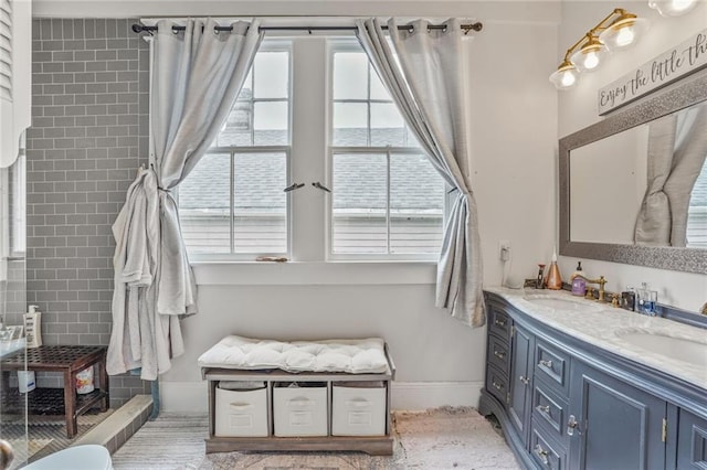 205 S Norman C Francis Pkwy, New Orleans, LA 70119 - full bathroom with double vanity, healthy amount of natural light, and baseboards
