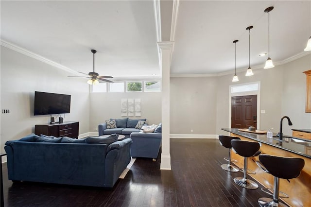 3445 Magnolia St, New Orleans, LA 70115 - living area with ceiling fan, dark wood-style floors, baseboards, and ornamental molding