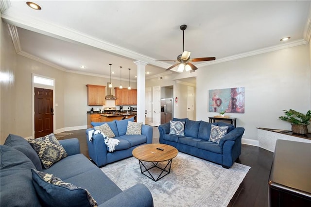 3445 Magnolia St, New Orleans, LA 70115 - living area featuring baseboards, dark wood-type flooring, decorative columns, ceiling fan, and recessed lighting