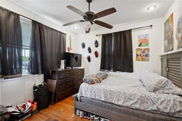 3445 Magnolia St, New Orleans, LA 70115 - bedroom with wood finished floors, ceiling fan, and recessed lighting