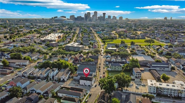 3445 Magnolia St, New Orleans, LA 70115 - aerial view of property and surrounding area featuring city skyline and nearby suburban area