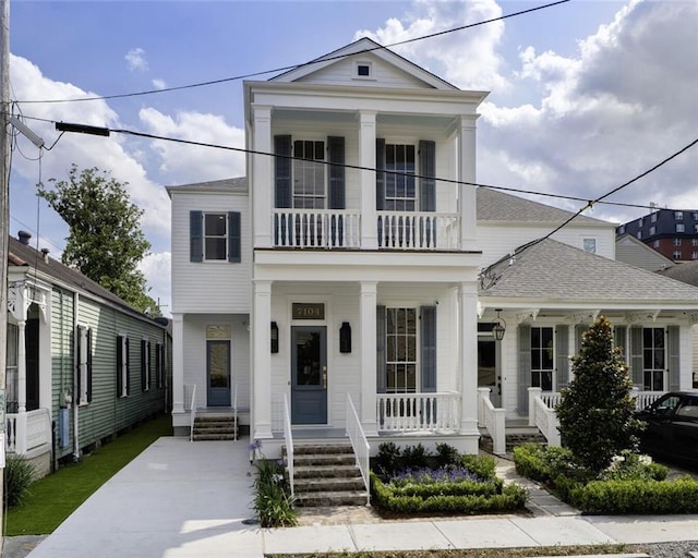 7104 Coliseum St, New Orleans, LA 70118 - greek revival inspired property with a balcony, covered porch, and a shingled roof