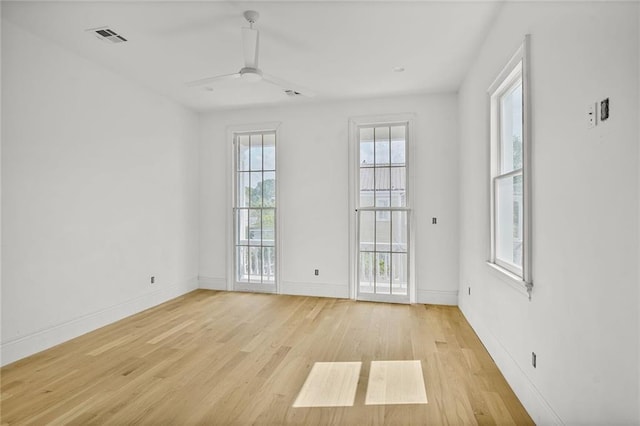 7104 Coliseum St, New Orleans, LA 70118 - empty room with light wood-style flooring, ceiling fan, and baseboards