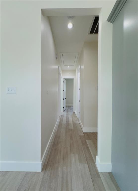 1421 David Dr, Metairie, LA 70003 - corridor featuring attic access, light wood finished floors, and baseboards