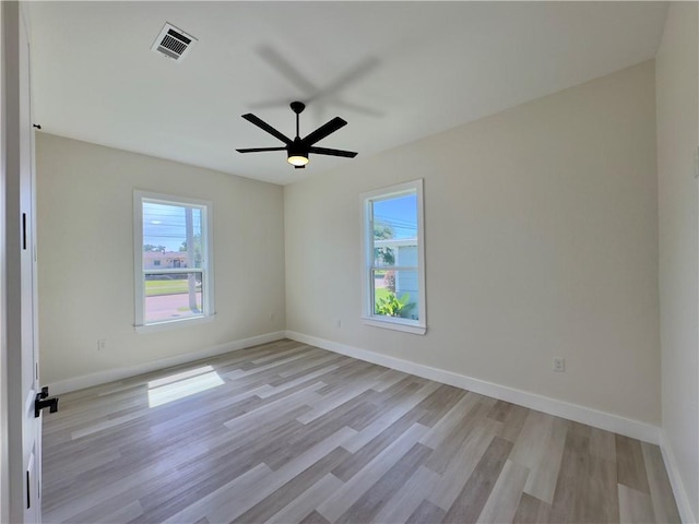 1421 David Dr, Metairie, LA 70003 - spare room with plenty of natural light, light wood-style floors, a ceiling fan, and baseboards
