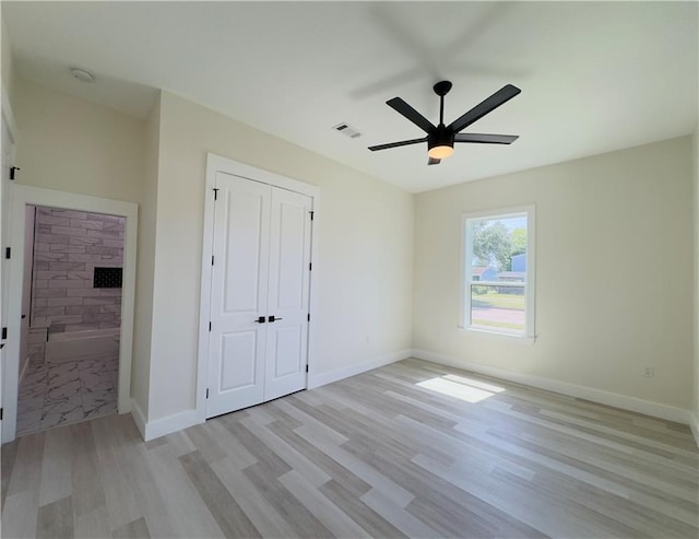 1421 David Dr, Metairie, LA 70003 - unfurnished bedroom with light wood finished floors, a closet, baseboards, and ceiling fan