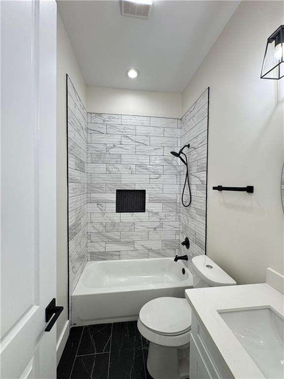 1421 David Dr, Metairie, LA 70003 - bathroom with toilet, vanity, marble look tile flooring, bathtub / shower combination, and recessed lighting