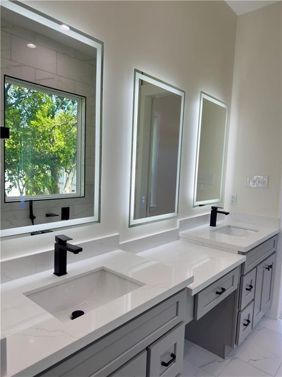 1421 David Dr, Metairie, LA 70003 - bathroom featuring double vanity and marble look tiles