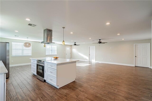 234 Murray Hill Dr, Destrehan, LA 70047 - kitchen featuring appliances with stainless steel finishes, island range hood, ceiling fan, baseboards, and pendant lighting