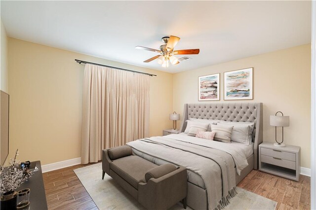234 Murray Hill Dr, Destrehan, LA 70047 - bedroom with baseboards, wood finished floors, and a ceiling fan