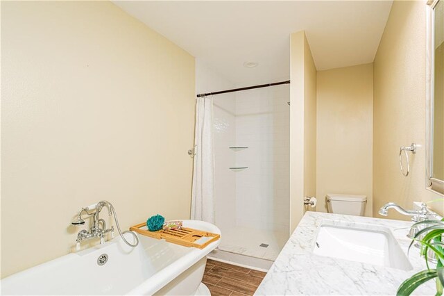 234 Murray Hill Dr, Destrehan, LA 70047 - bathroom with a freestanding bath, toilet, a shower stall, vanity, and wood tiled floors