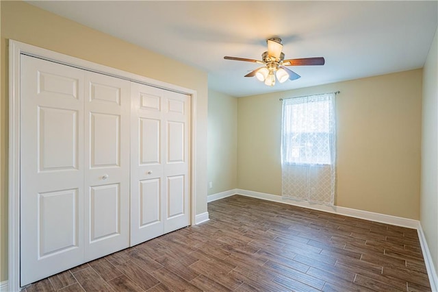 234 Murray Hill Dr, Destrehan, LA 70047 - unfurnished bedroom with baseboards, dark wood-style flooring, and a closet
