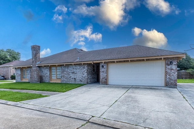 3701 Red Cypress Dr, New Orleans, LA 70131 - ranch-style home featuring brick siding, driveway, an attached garage, and a front lawn