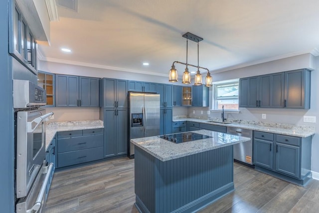 3701 Red Cypress Dr, New Orleans, LA 70131 - kitchen with stainless steel appliances, a sink, crown molding, glass insert cabinets, and light stone countertops