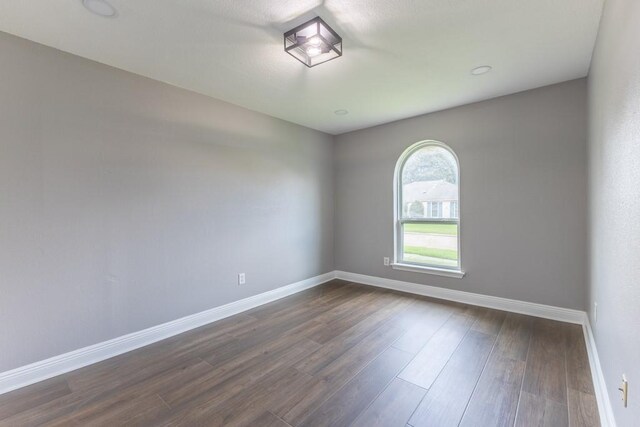 3701 Red Cypress Dr, New Orleans, LA 70131 - empty room featuring baseboards and dark wood-type flooring