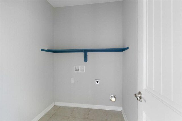 728 Lakeshore Village Dr, Slidell, LA 70461 - laundry room with hookup for an electric dryer, hookup for a washing machine, light tile patterned flooring, and baseboards